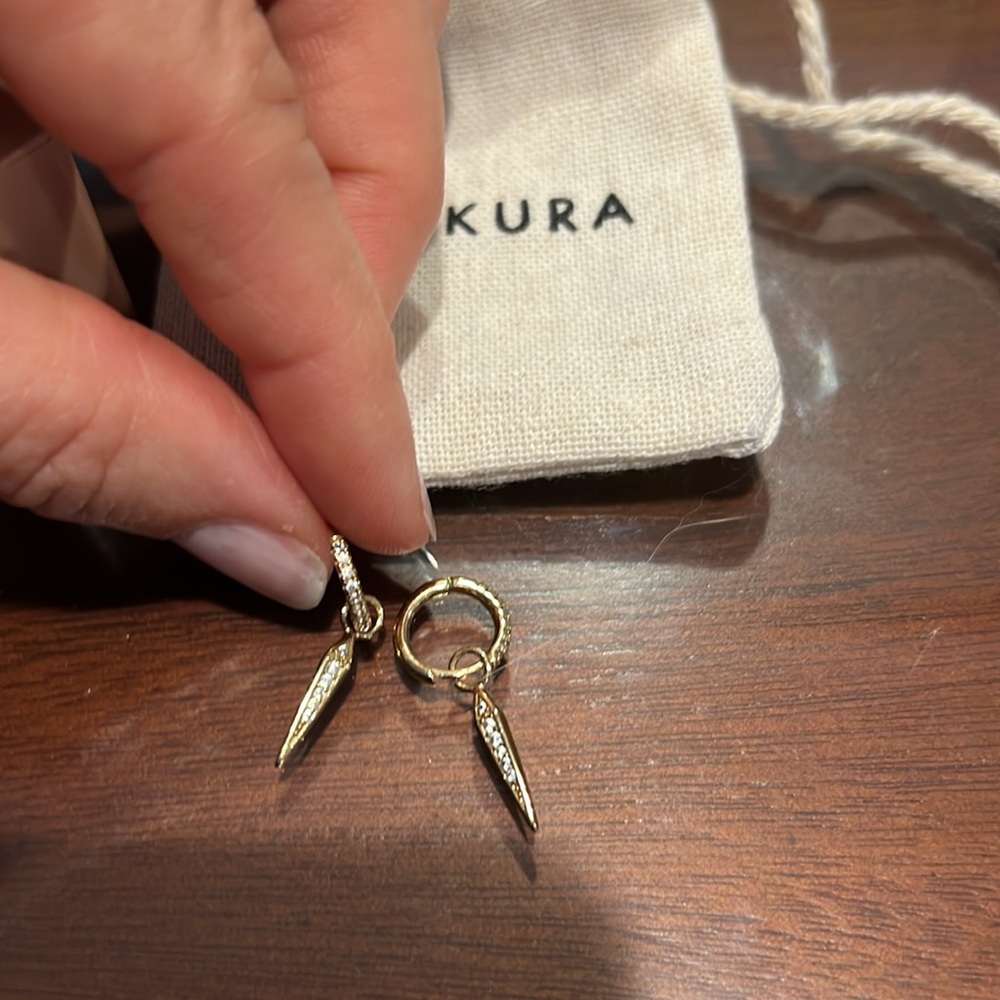 Waekura mini creole earrings with charms from Le Bon Marché in Paris.
